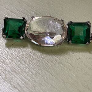 Vintage cut glass C clasp brooch. Green & clear prong set